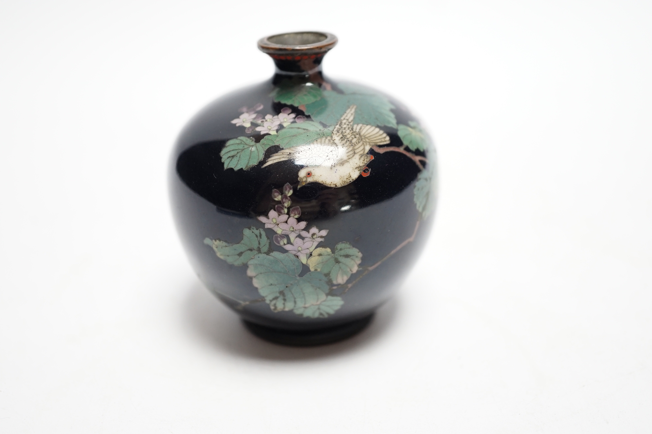 A Japanese silver wire cloisonné enamel miniature globular vase, Meiji period, decorated with a dove amid flowering branches, 6.5cm high